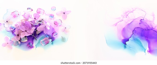 Creative Image Of Pink And Purple Hydrangea Flowers On Artistic Ink Background. Top View With Copy Space