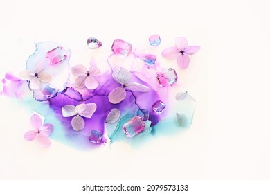 Creative Image Of Pink And Purple Hydrangea Flowers On Artistic Ink Background. Top View With Copy Space