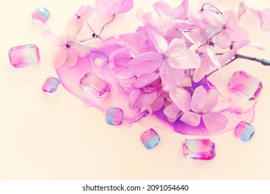 Creative Image Of Pink And Purple Hydrangea Flowers On Artistic Ink Background. Top View With Copy Space