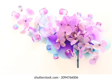 Creative Image Of Pink And Purple Hydrangea Flowers On Artistic Ink Background. Top View With Copy Space