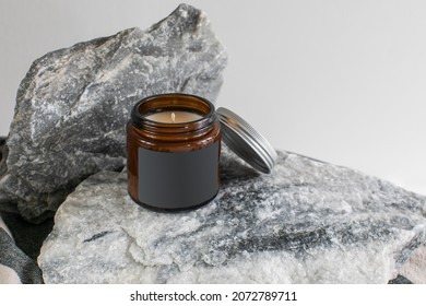 Creative Label Mockup Of The Dark Glass Jar With Handmade Candle On The Granite Background
