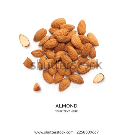 Creative layout made of almonds on the white background. Flat lay. Food concept. Macro concept. 