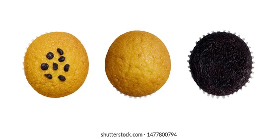 Creative layout made of assorted fresh tasty muffins or cupcakes isolated on a white background. Object concept. Top view. Flat lay. Food concept. Macro concept. Close up with copy space.