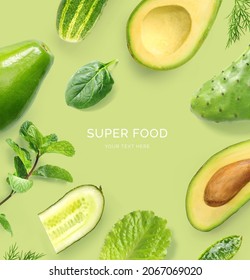 Creative layout made of avocado, cucumber, nopal, salad lettuce and mint on the green background. Flat lay. Food concept. Macro  concept.