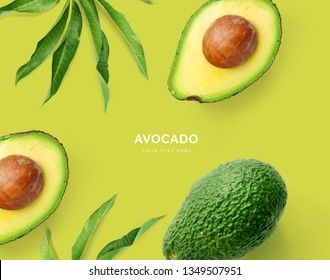 Creative layout made of avocado. Flat lay. Food concept. Macro concept. Green background.