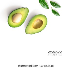 Creative layout made of avocado and leaves. Flat lay. Food concept. Avocado on white background.