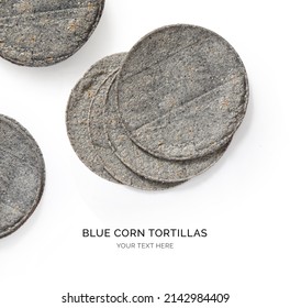 Creative Layout Made Of Blue Corn Tortilla On The White Background. Flat Lay. Food Concept. Macro  Concept.