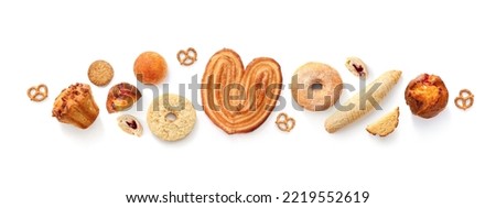Creative layout made of breads, sweets, donuts, muffins and buns on the white background. Flat lay. Food concept. Pastry on the white.