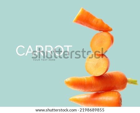 Creative layout made of carrot on the turquoise background. Flat lay. Food concept. Macro  concept. 