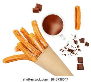 Creative layout made of Churros fried pastry, cup of dark chocolate and chocolate pieces  isolated on a white background, top view. Flat lay
