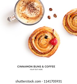 Creative Layout Made Of Cinnamon Buns And Cup Of Coffee On The White Background. Flat Lay. Food Concept.