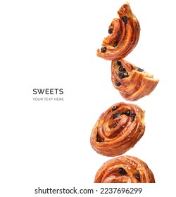 Creative layout made of cinnamon buns on the white background. Flat lay. Food concept. Sweets and Pastry.