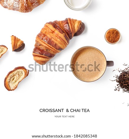Creative layout made of croissant and a cup of chai tea on a white background. Top view.