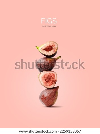 Creative layout made of figs on the pink background. Flat lay. Food concept. Macro concept. 
