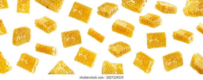 Creative Layout Made Of Floating Honeycombs And Flying Sweet Sticky Honey Puddle Isolated On White Background. Healthy Food Concept.