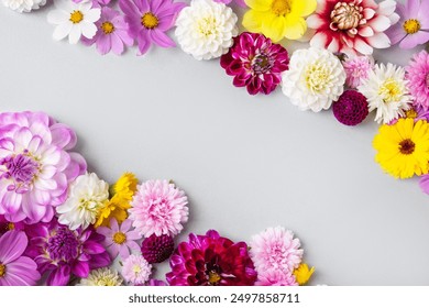 Creative layout made of flowers asters, dahlias, calendula. Floral Greeting card. Colorful autumn flower background with space for text. Nature trendy decorative design. Nature concept. Flat lay.