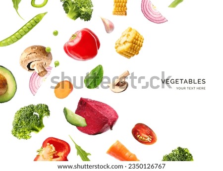 Creative layout made of flying vegetables on the white background. Flat lay. Food concept. Macro  concept of avocado, broccoli, corn, peppers, carrot, garlic, onion, beetroot, tomato, cucumber.