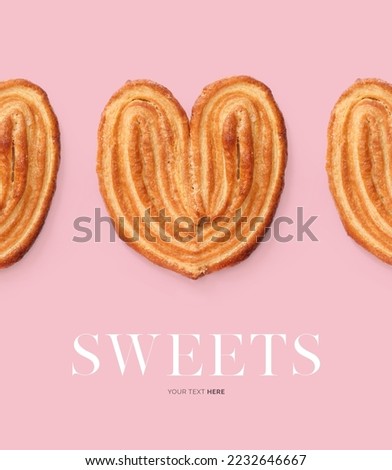 Creative layout made of French Palmier Cookies on the pink background. Flat lay. Food concept. Sweet Pastry.