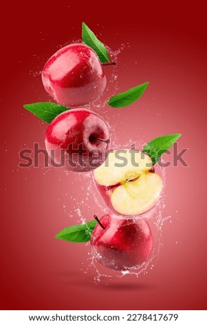 Creative layout made from Fresh Red apple and water splashing on the red background