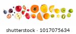 Creative layout made of fruits. Flat lay. Plum, apple, strawberry, blueberry, papaya, pineapple, lemon, orange, lime, kiwi, melon, apricot, pitaya, mango and carambola on the white background.
