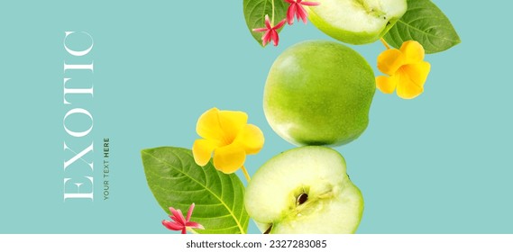 Creative layout made of green apple on the blue background with exotic flowers and leaves. Flat lay. Food concept. Macro  concept.