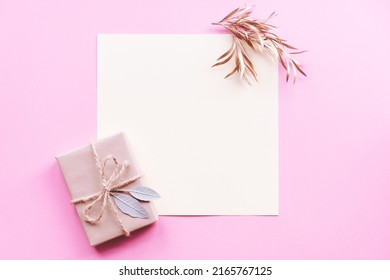 Creative Layout Made Of Green Leaves With Diy Gift Box On Pink Background. Flat Lay. Nature Concept