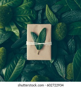 Creative Layout Made Of Green Leaves With Diy Gift Box. Flat Lay. Nature Concept