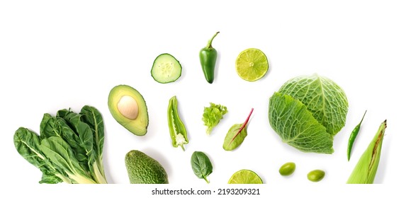 Creative layout made of green vegetables on the white background. Flat lay. Food concept. Macro  concept. Avocado, cabbage, lime, cucumber, corn, peppers and salad on the white background. - Powered by Shutterstock