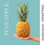 Creative layout made of hand holding a pineapple on the blue background. Food concept. Macro concept.