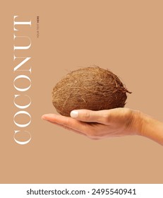 Creative layout made of hand holding a coconut on the beige background. Food concept. Macro concept.