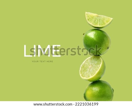 Creative layout made of lime on the green background. Flat lay. Food concept.