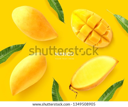 Creative layout made of mango. Flat lay. Food concept. Macro concept. Yellow background.