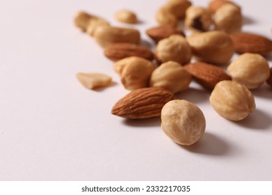 Creative layout made of nuts on a white background. Flat lay. Place for text. Nutrition concept.