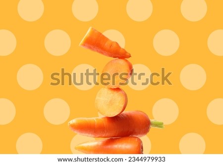 Creative layout made of orange carrot on the orange background with dots. Flat lay. Food concept. Macro concept.