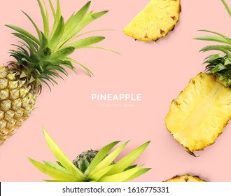 Creative layout made of pineapple. Flat lay. Food concept. Pineapple on the pink background.