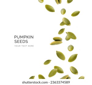 Creative layout made of pumpkin seeds on the white background. Flat lay. Food concept. Macro concept. 