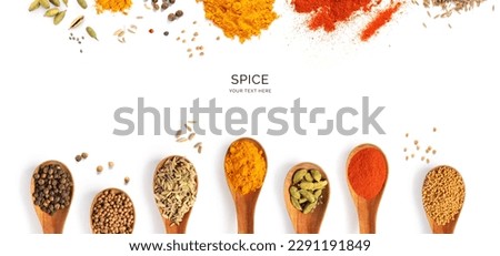 Creative layout made of spices, cardamon, chilli pepper, cumin, curry, coriander, paprika, seeds, anise, black pepper, mustard seeds on the white background. Flat lay. Food concept.	