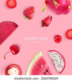 Creative layout made of  strawberry, raspberry, watermelon, dragon fruit, cherry and mangosteen  on the pink background. Flat lay. Food concept. Macro  concept.