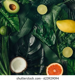 Creative Layout Made Of Summer Tropical Fruits And Leaves. Flat Lay. Food Concept.