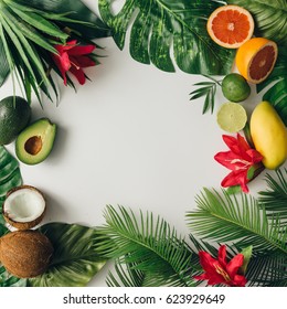 Creative Layout Made Of Summer Tropical Fruits And Leaves. Flat Lay. Food Concept.