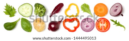 Creative layout made of tomato slice, onion, cucumber, basil leaves. Flat lay, top view. Food concept. Vegetables isolated on white background. Food ingredient pattern. Banner.