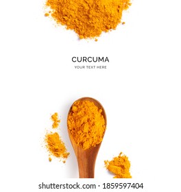 Creative layout made of turmeric powder and wood spoon on a white background. Top view.  