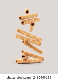 Creative layout made of wafer roll on the gray background. Food concept. Macro concept.
