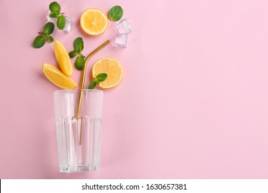 Creative Lemonade Layout With Lemon Slices, Mint And Ice On Pink Background, Top View. Space For Text