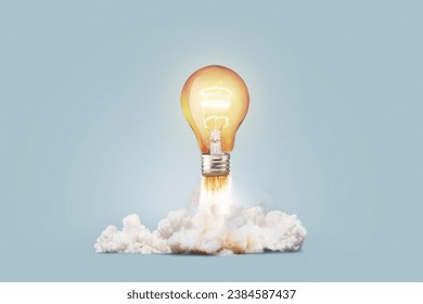 Creative light bulb rocket with blast and smoke takes off on a blue background, concept. Successful launch and development, creative idea. Think differently. Creative generator. Smart and thinking - Powered by Shutterstock