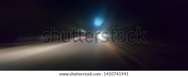 Creative light trails. Vehicle light blurred and\
light trails shot taken.Shot with radial blur effect.Cinematic wide\
angle shot.