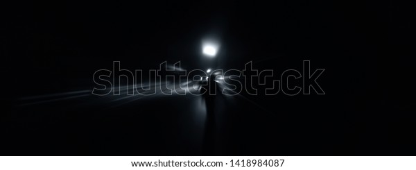 Creative light trails. Vehicle light blurred\
and light trails shot taken.Shot with radial blur effect. Concept\
of Speed and Fastness.