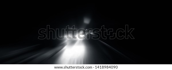 Creative light trails. Vehicle light blurred\
and light trails shot taken.Shot with radial blur effect. Concept\
of Speed and Fastness.