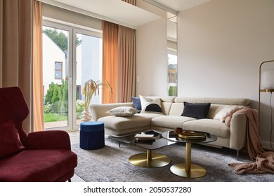 Creative Living Room Interior Composition With Beige Sofa, Glass Coffee Table, Carpet On The Floor And Glamorous Accessories. Template.