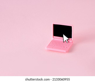 Creative Look Of A Computer With A Pixel Arrow On A Pastel Pink Background. Aesthetic Idea Of Retro Style Of The 80s And 90s. The Modern Concept Of The Ancient Computer.